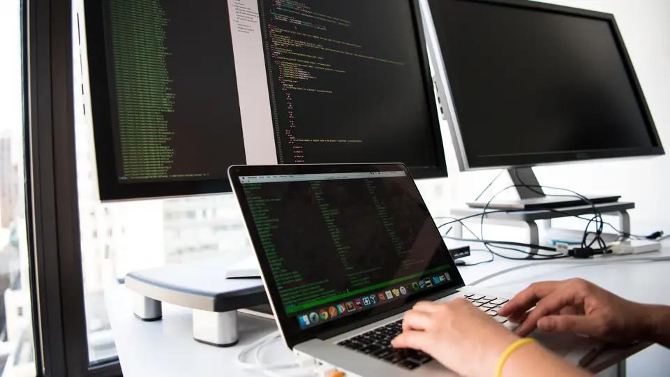 Workstation with source code on several screens